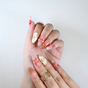 Handmade nude and blush nails with gradient petals and pearl flower art