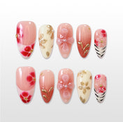 Pink and red floral press-on nails with 3D bow and gold leaf accents