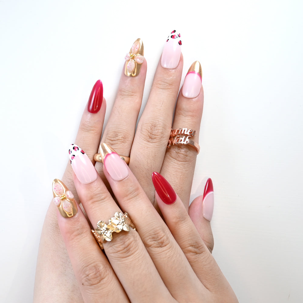 Valentine’s press-on nails with chic leopard print and metallic accents