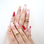 Valentine’s press-on nails with chic leopard print and metallic accents