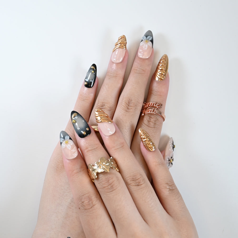 Luxury press-on nails with black gradient, pearls, and 3D blossoms