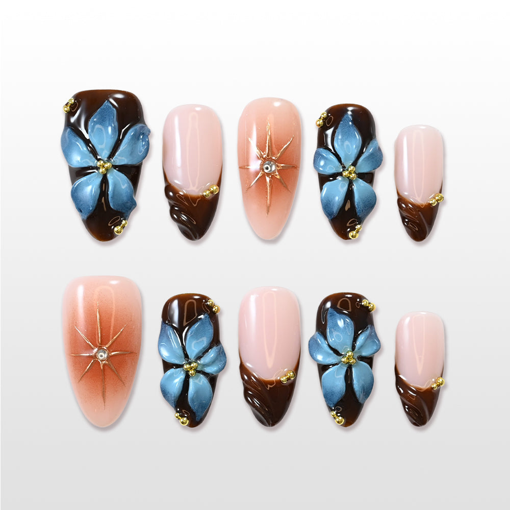 Brown French press-on nails with 3D blue flower and nude pink base
