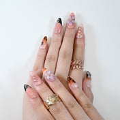 Reusable press-on nails with leopard print detail and pastel blossoms