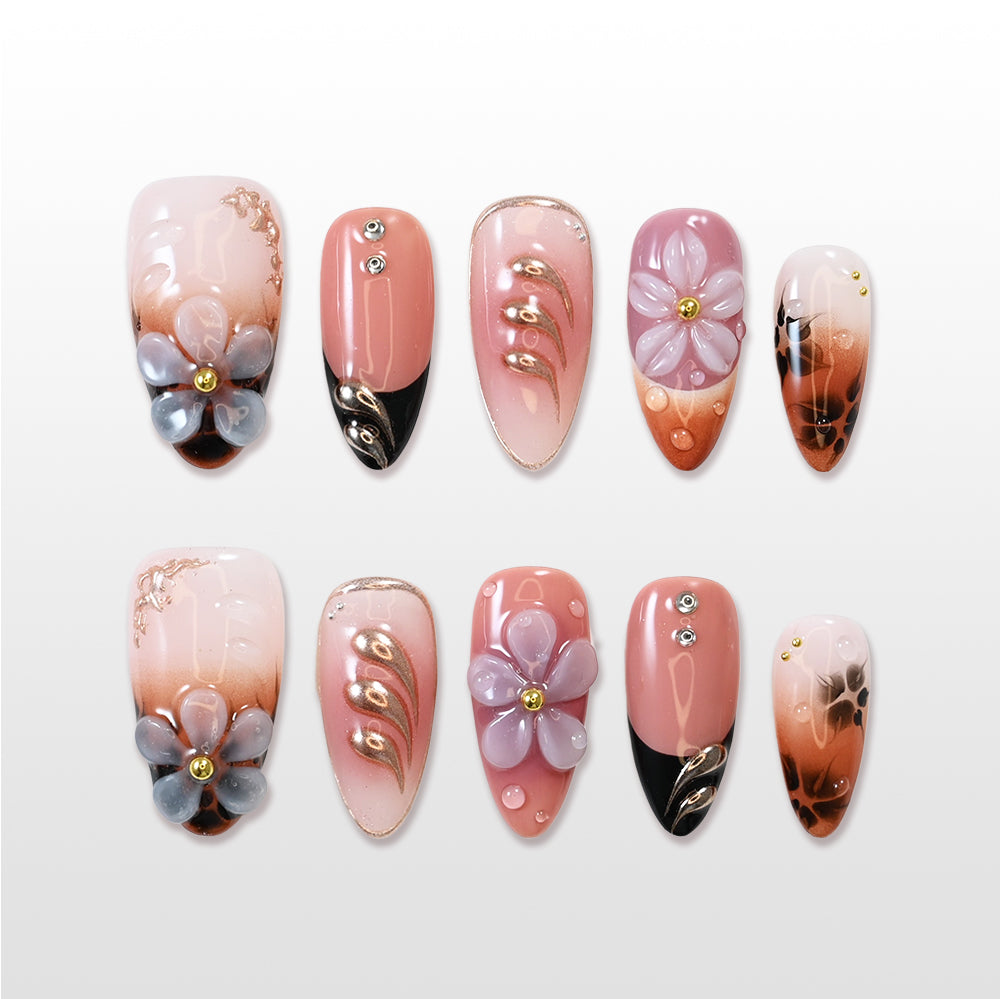 Nude gradient press-on nails with 3D flower and black tips
