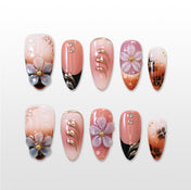 Nude gradient press-on nails with 3D flower and black tips