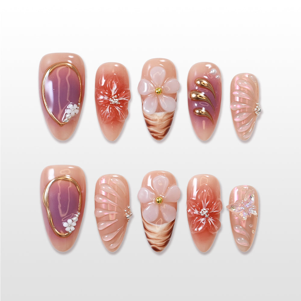 Nude pink press-on nails with 3D flower and gold swirl details