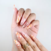 Reusable press-on nails with blush petals and shiny mirror finish