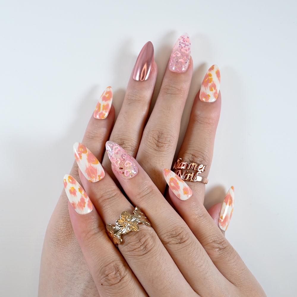 Spring press-on nails with pink sequins and romantic floral design