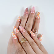 Spring press-on nails with pink sequins and romantic floral design