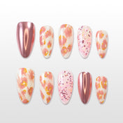 Pink floral press-on nails with rose gold chrome accents