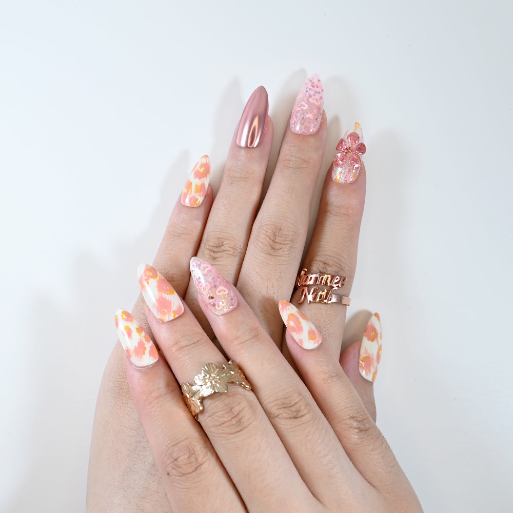 Romantic press-on nails with rose gold finish and spring flower design