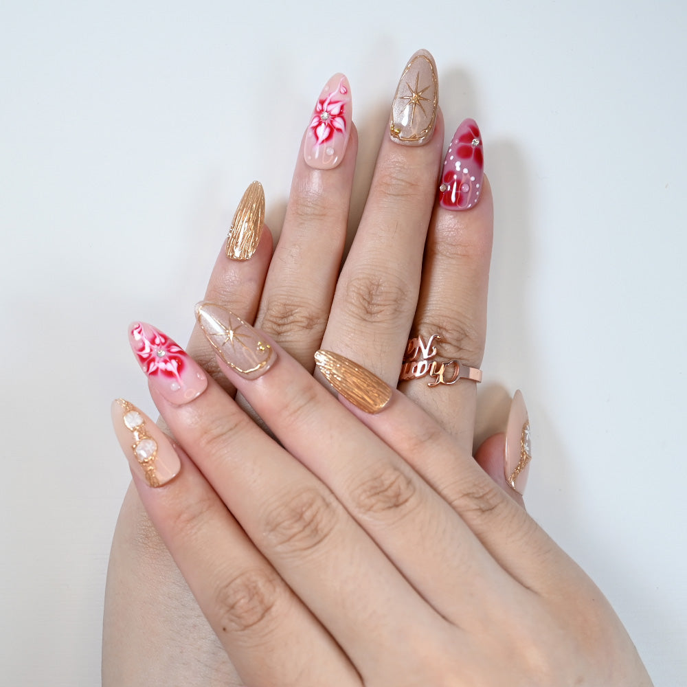 Charmeenail luxury acrylic nails in red marble with golden foil and 3D details