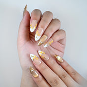 Charmeenail luxury acrylic nails in nude base with gold shimmer and floral art