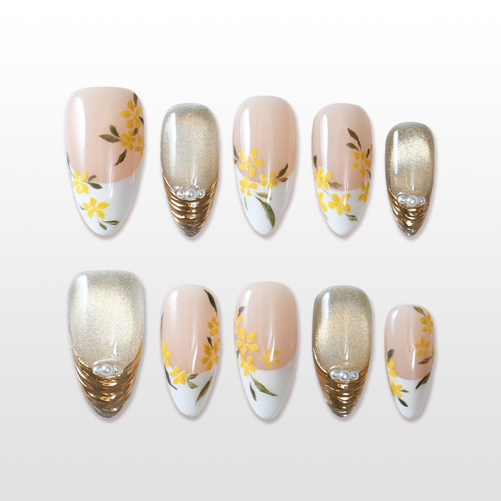Handmade nude and yellow press on nails with floral and gold glitter design