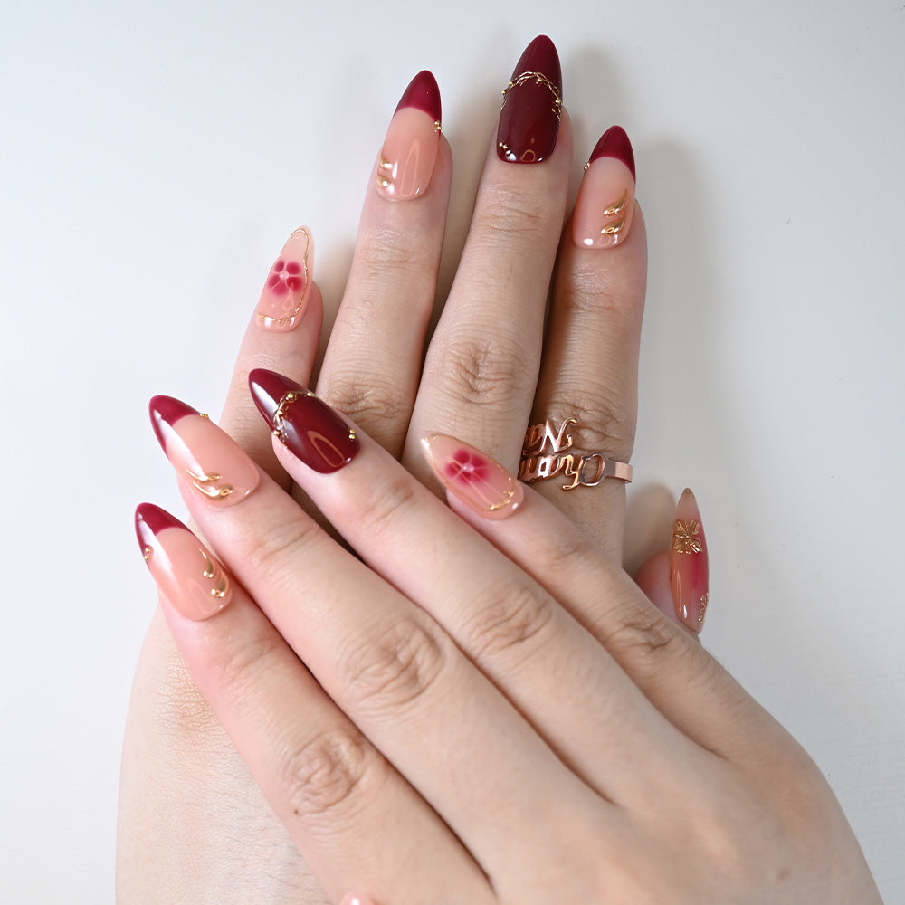 Charmeenail luxury acrylic nails in red and nude ombre with elegant flower patterns