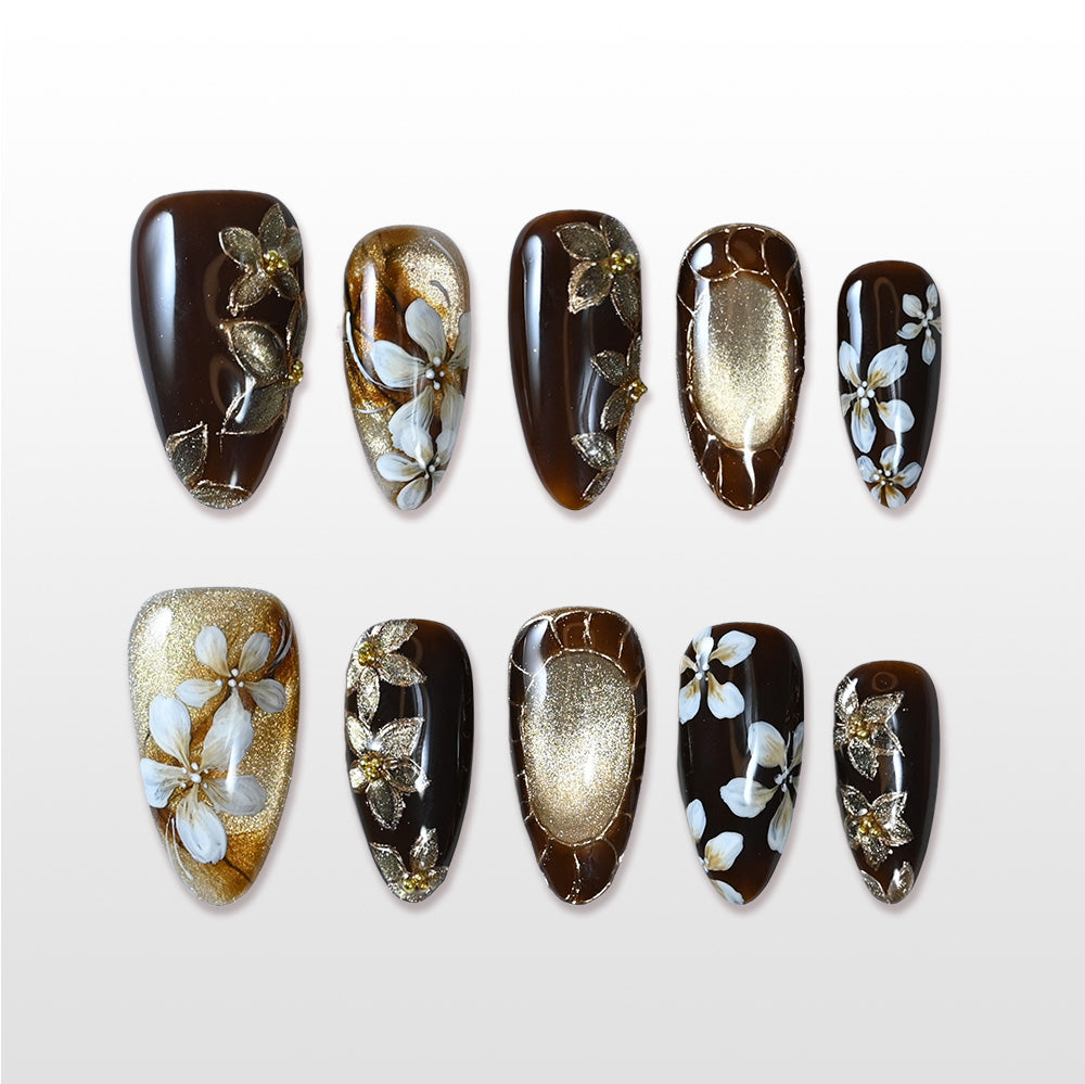 Handmade black and gold press on nails with white floral and shimmer design