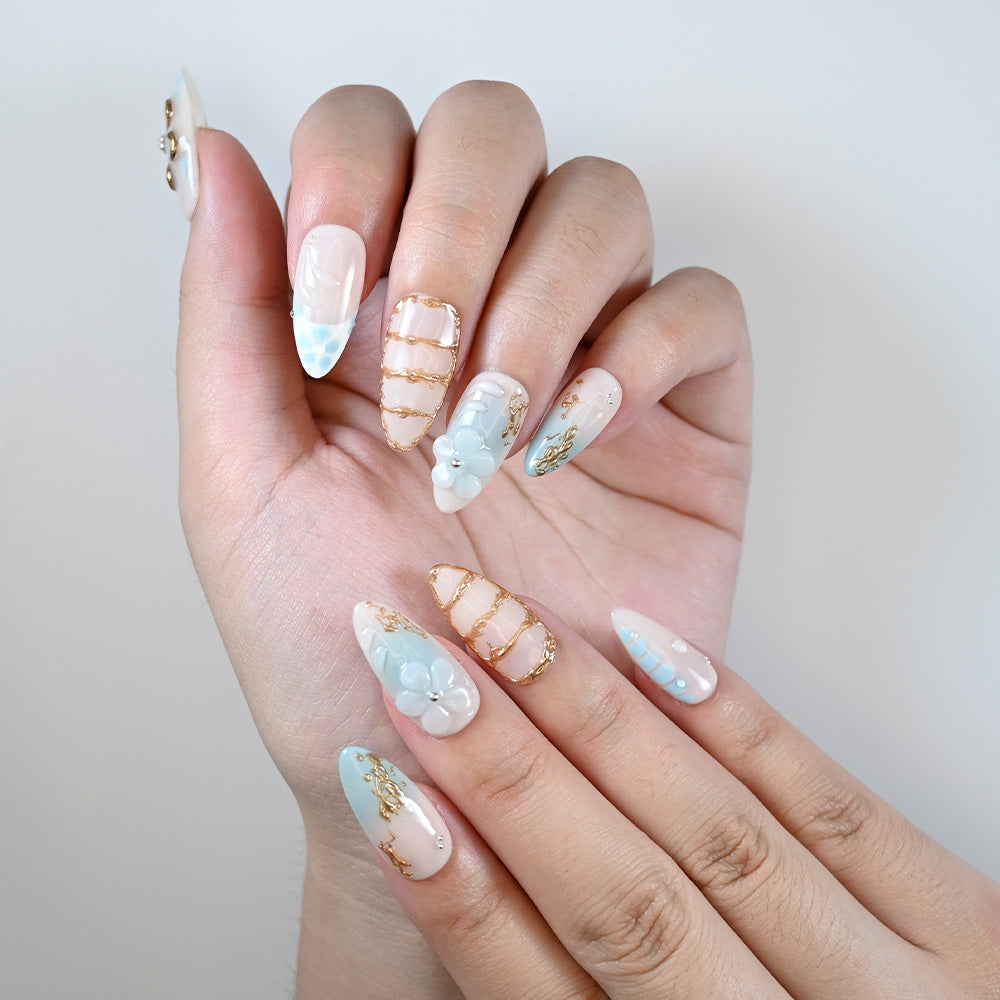 Charmeenail luxury acrylic nails featuring soft blue gradient, pearls and gold chain style
