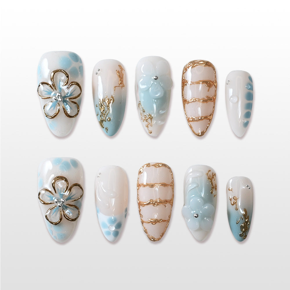 Handmade blue and white press on nails with 3D flower and gold chain design