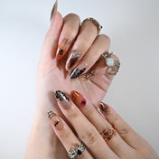 Medium almond Halloween press-on nails with creepy spiderweb and bat art