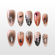 Handmade nude press on nails with black spider and silver web design