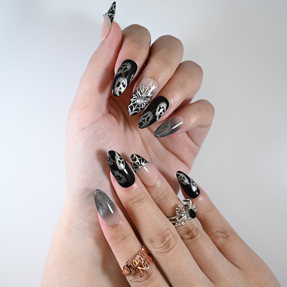 Medium almond reusable press-on nails with glitter silver spiderweb accents