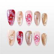 Handmade red and gold press on nails with marble floral and starburst design