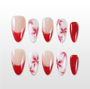 Handmade red and white press on nails with floral design and gold bead accents