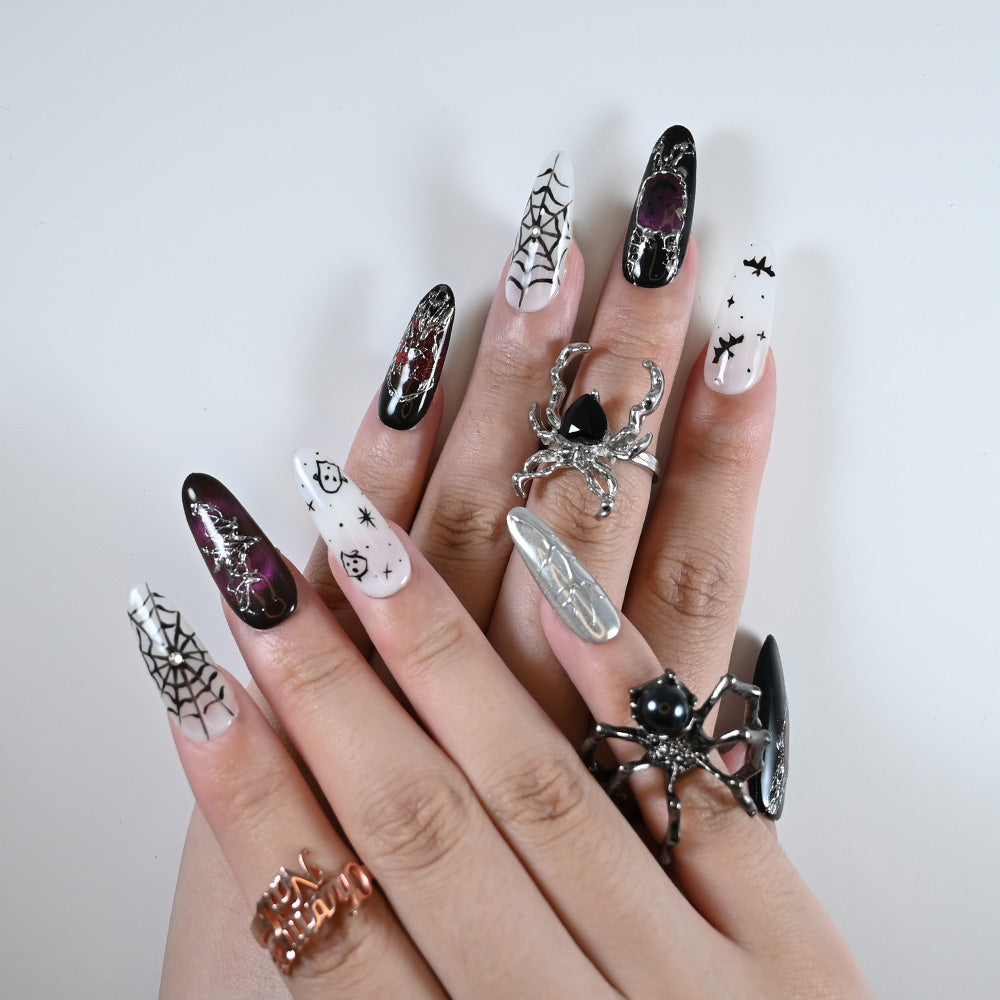 Charmeenail luxury acrylic nails in black and white with Halloween spider and ghost art