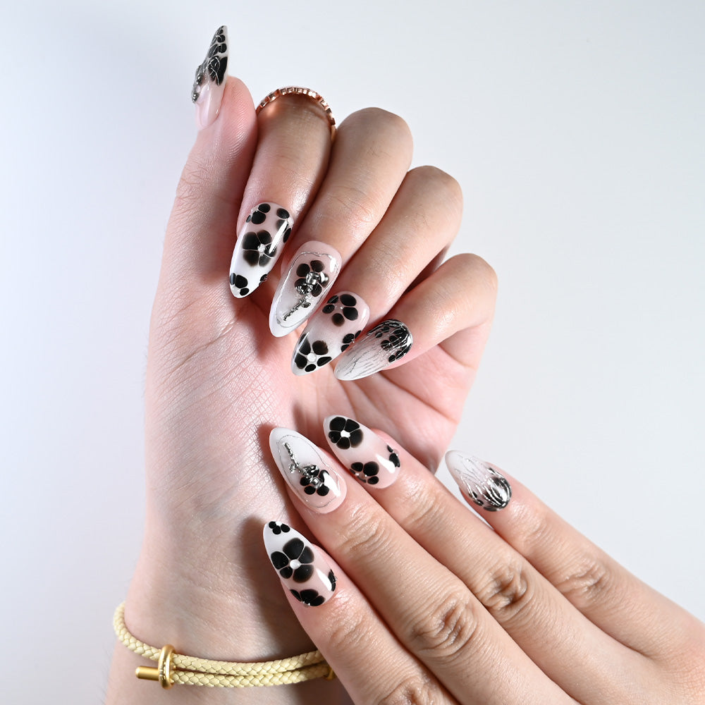 Charmeenail handmade press on nails featuring black flowers and silver cross details