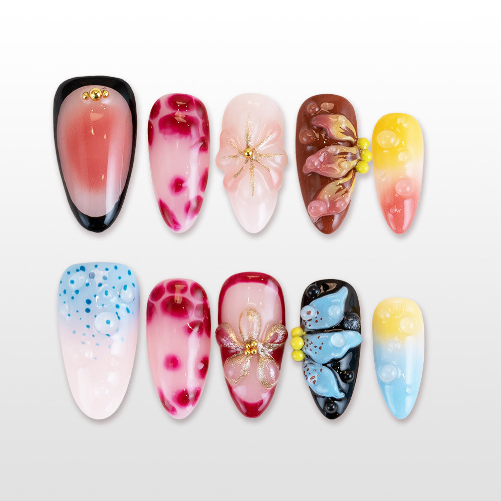 Colorful press-on nails with 3D floral accents, gradient tips, and abstract designs