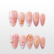 3D pink floral press-on nails with pearl accents and gold swirl details