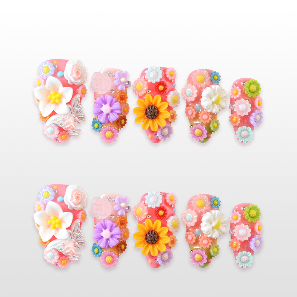 Colorful 3D floral press-on nails with sunflowers, roses, daisies, and pastel blossoms