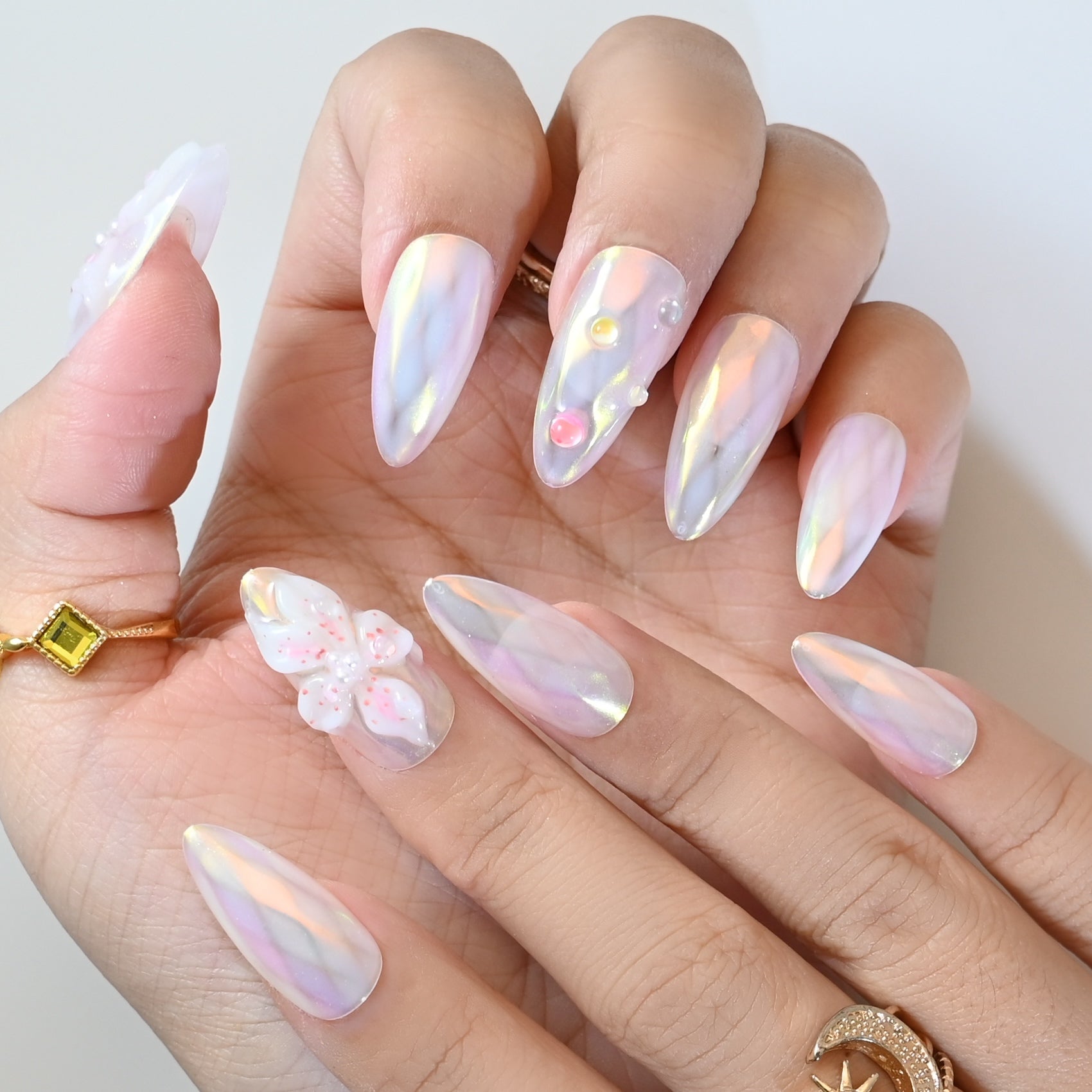 Opal effect press-on nails with 3D blossoms, rainbow reflection, and crystal beads