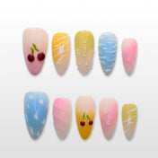 Pastel press-on nails with 3D cherry accents, yellow ombre, and candy colors