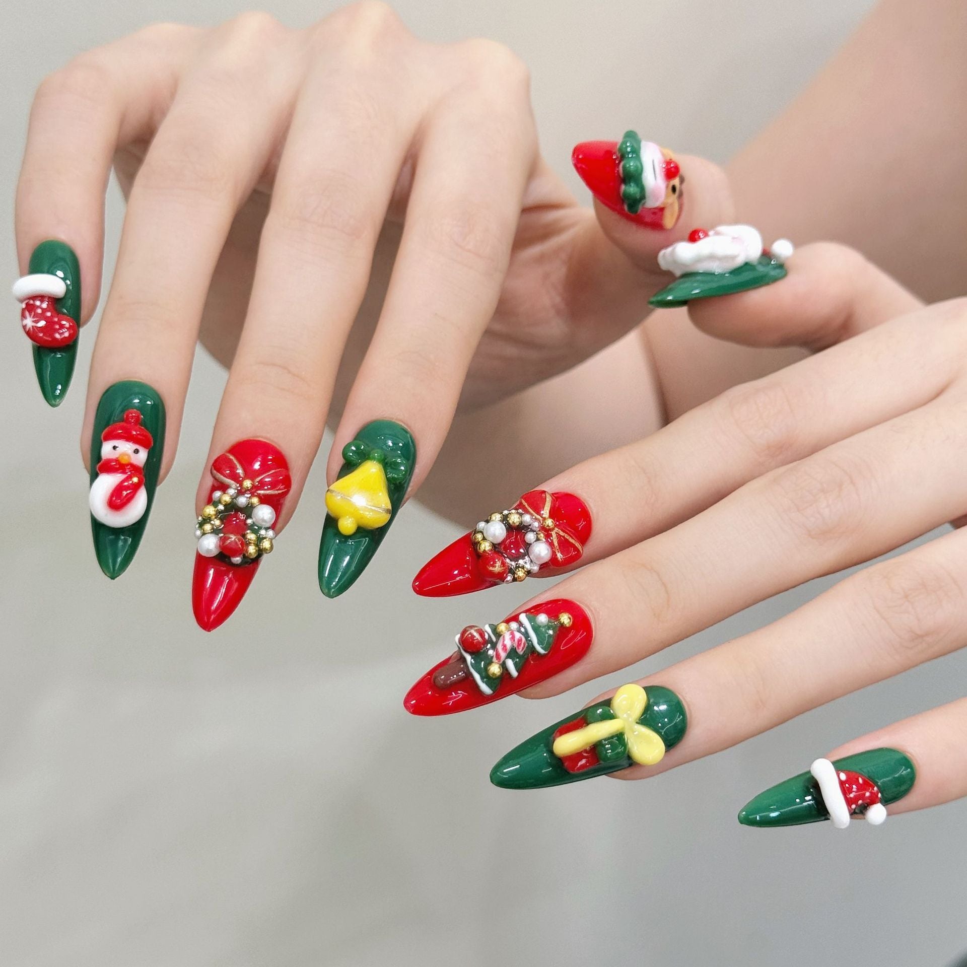 Handmade Christmas nails with gifts, wreaths, and Santa design