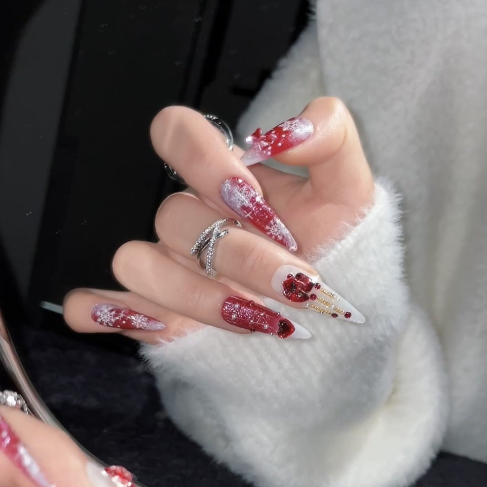 Luxury holiday nails with pearls, bows and 3D red gift decorations