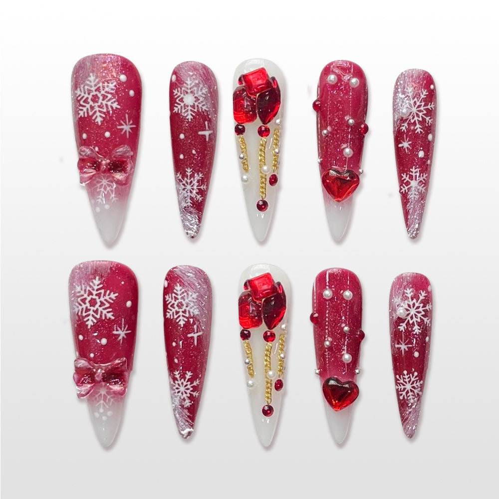 Red and white Christmas nails with snowflakes, bows, pearls and 3D gift box accents