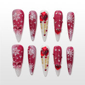 Red and white Christmas nails with snowflakes, bows, pearls and 3D gift box accents
