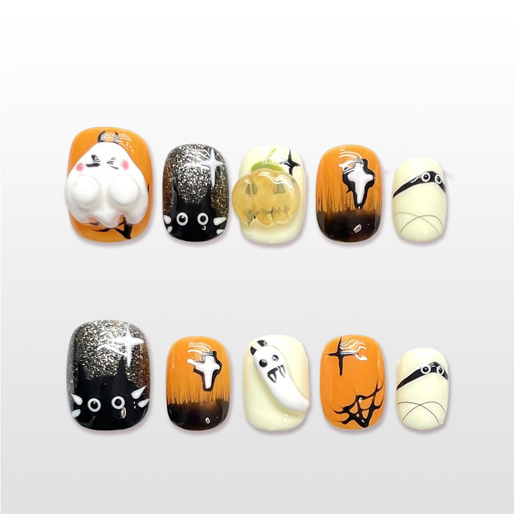 Halloween press on nails with ghost, pumpkin, and cat design