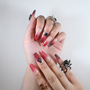 Medium Coffin reusable press-on nails in red gradient with spooky spider web accents