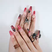 Charmeenail acrylic nails featuring black spiders, blood red tones, and Halloween horror style
