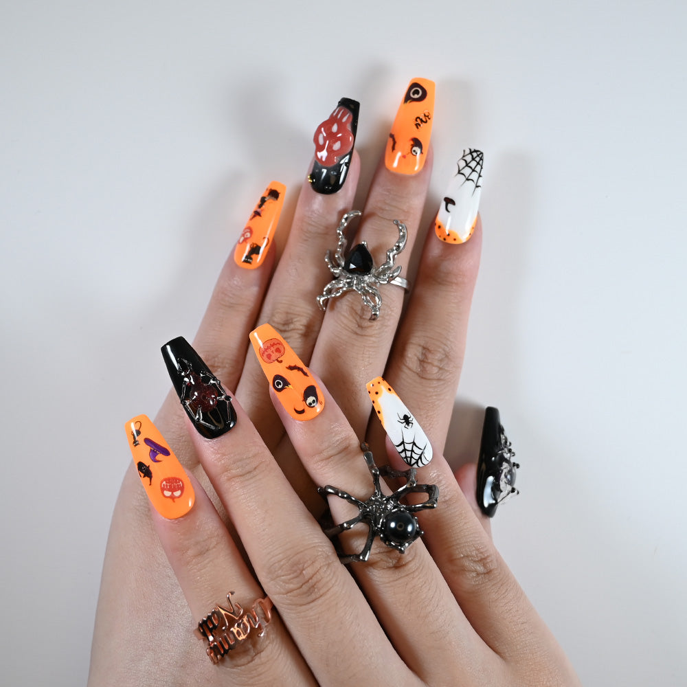Charmeenail acrylic nails in Halloween style with ghost eyes, bats, and 3D pumpkin art