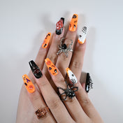 Charmeenail acrylic nails in Halloween style with ghost eyes, bats, and 3D pumpkin art