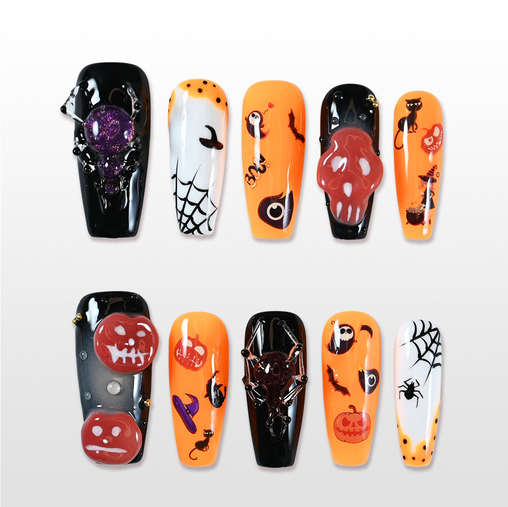 Handmade orange and black press on nails with 3D skull and glitter spider design