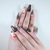 Salon quality Halloween press on nails featuring bloody stitches and spooky skull art
