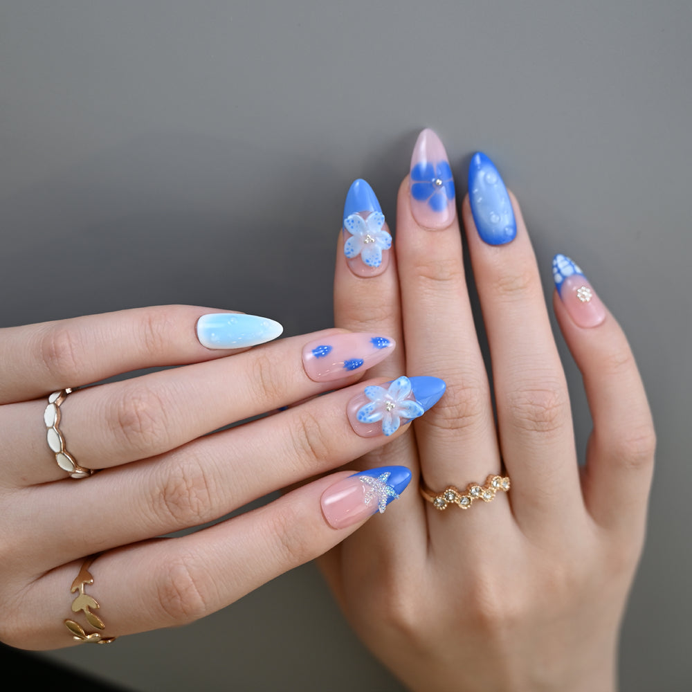 Summer seaside press-on nails in blue and pink with marine floral patterns