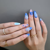 Summer seaside press-on nails in blue and pink with marine floral patterns