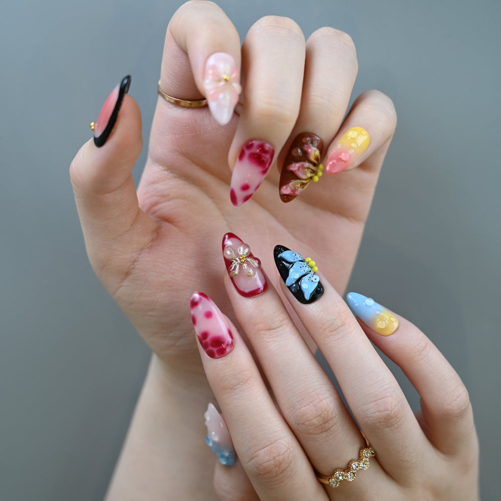 Handmade medium almond nails featuring ombre, animal print, and 3D flower art