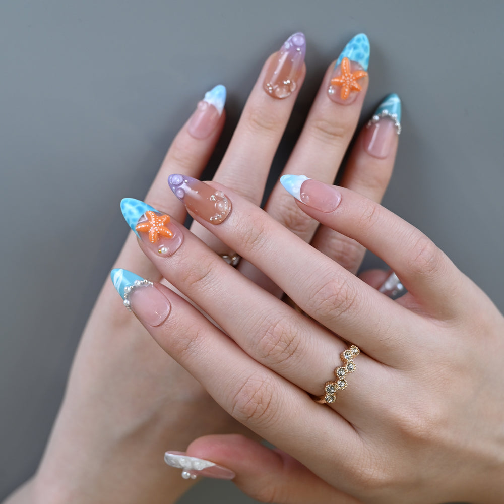 Summer vacation press-on nails with turquoise waves, pearls, and ocean textures