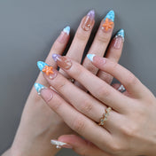 Summer vacation press-on nails with turquoise waves, pearls, and ocean textures